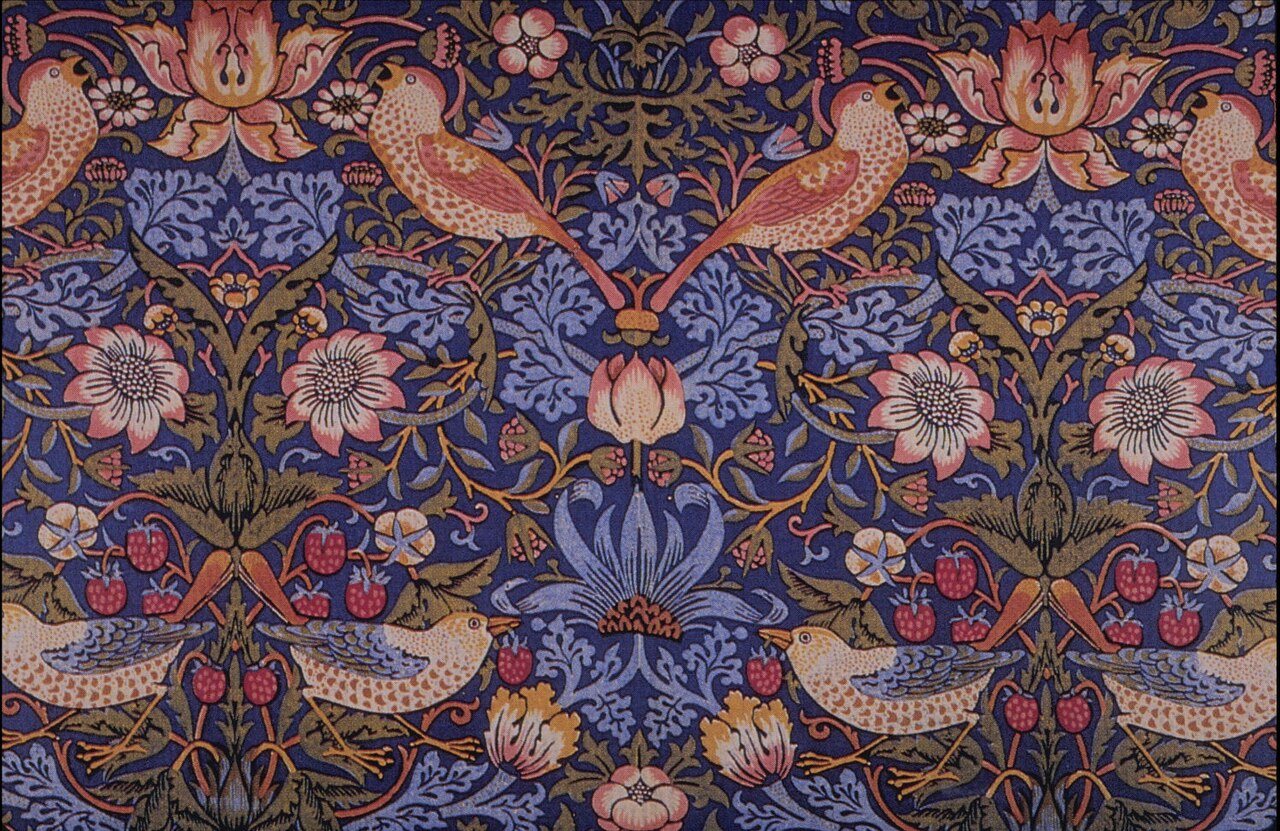 William Morris's Strawberry Thief pattern, with thrushes and strawberries on a deep indigo background